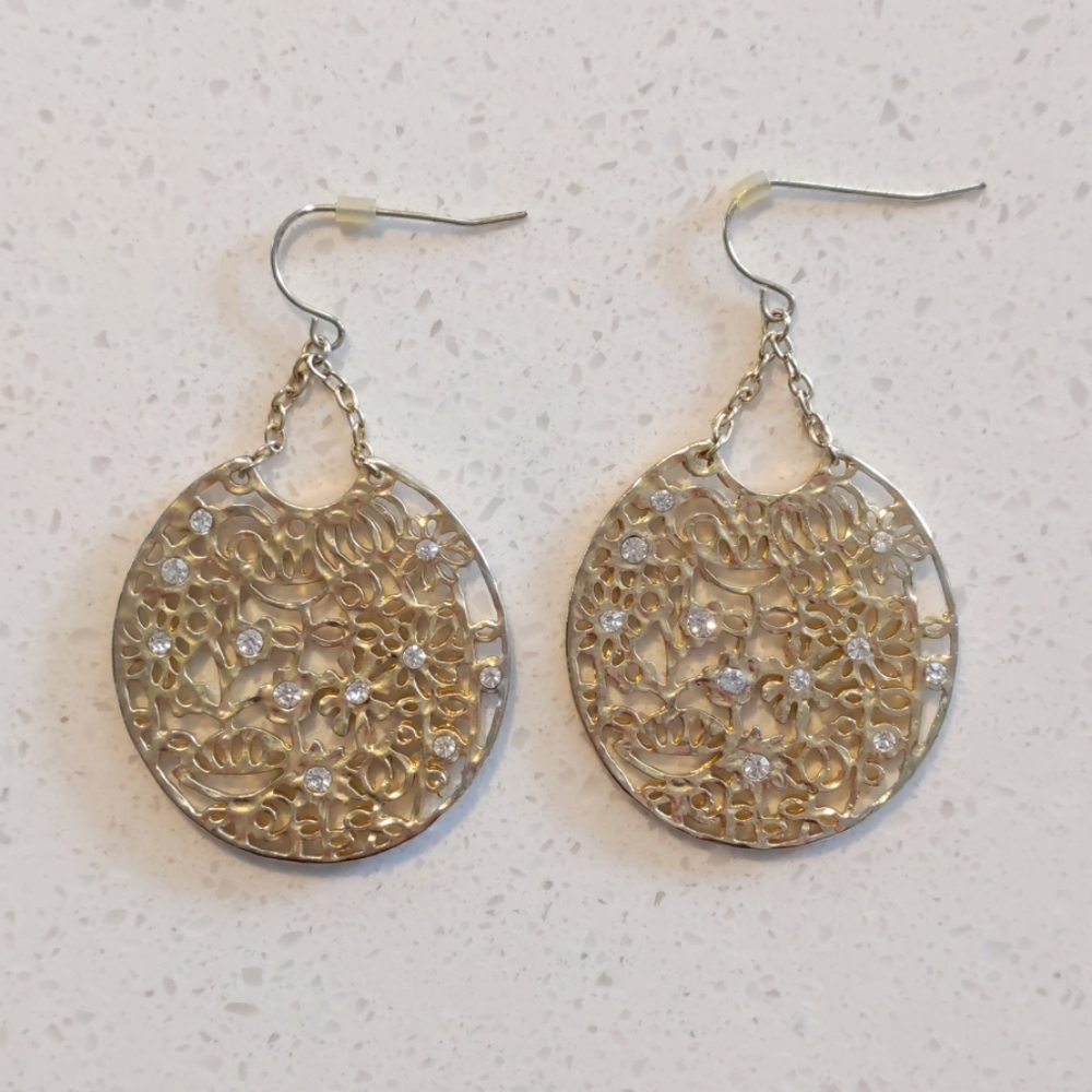 Gold floral design earrings with clear gems